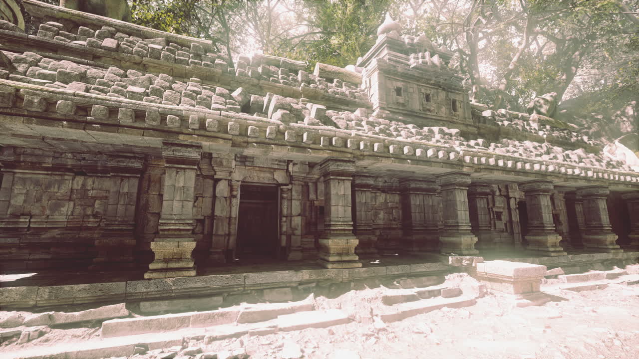 Ancient temple ruins in cambodia surrounded by lush greenery at midday
