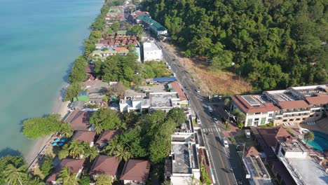 Aerial drone footage of White Sand Beach village, Koh Chang, Thailand. Capturing sunny morning views of the coast and tropical scenery