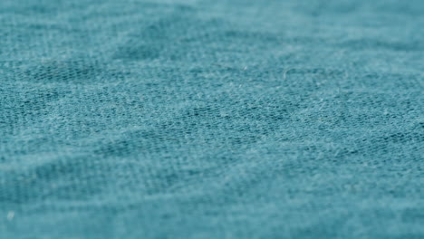 teal fabric texture close-up