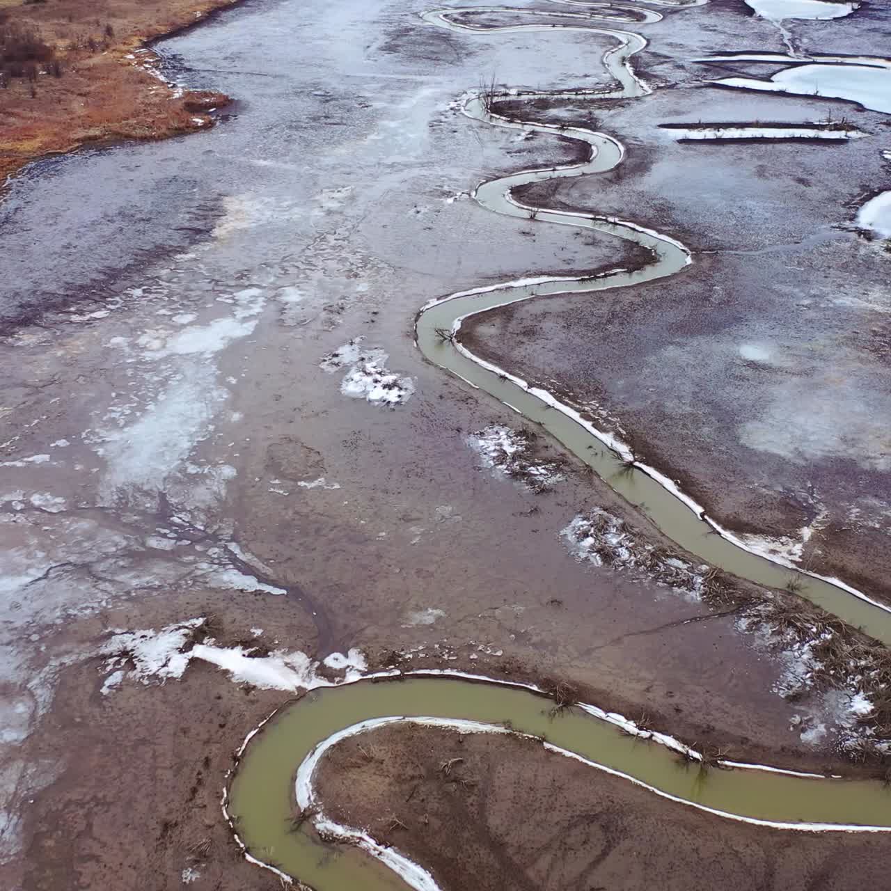 Natural problems of water. Dirty stream of dried lake. Gloomy background of environment. Global warming. Aerial view