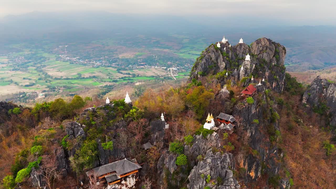scenic aerial drone sky temple in Lampang Thailand mountaintop pagodas of Wat Chaloem Phra Kiat