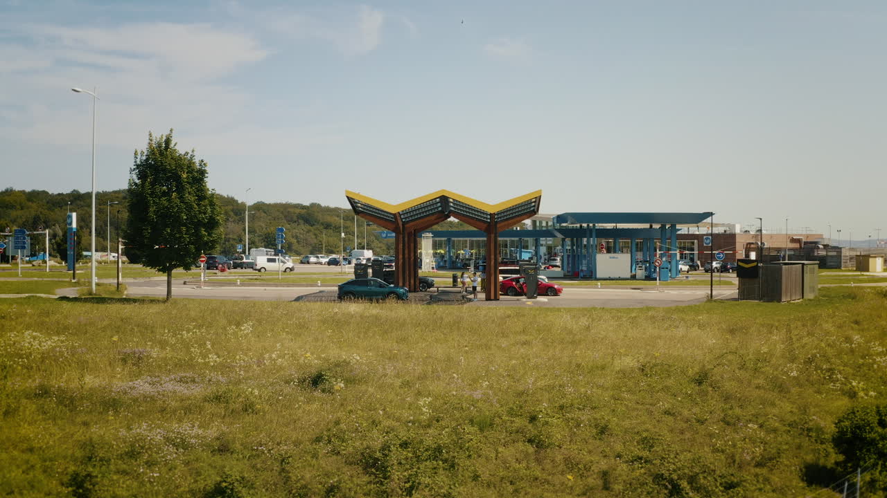 Cars refueling at a modern gas station