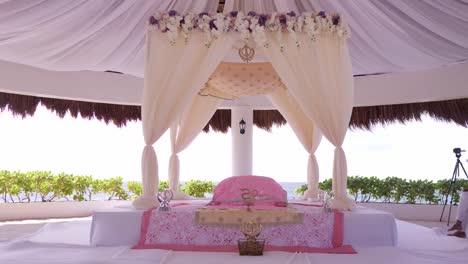 an approaching view of a altar erected for an indian wedding ceremony