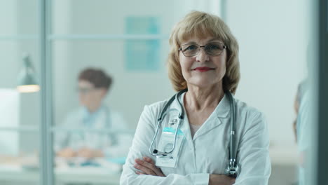 portrait of cheerful senior female doctor in clinic