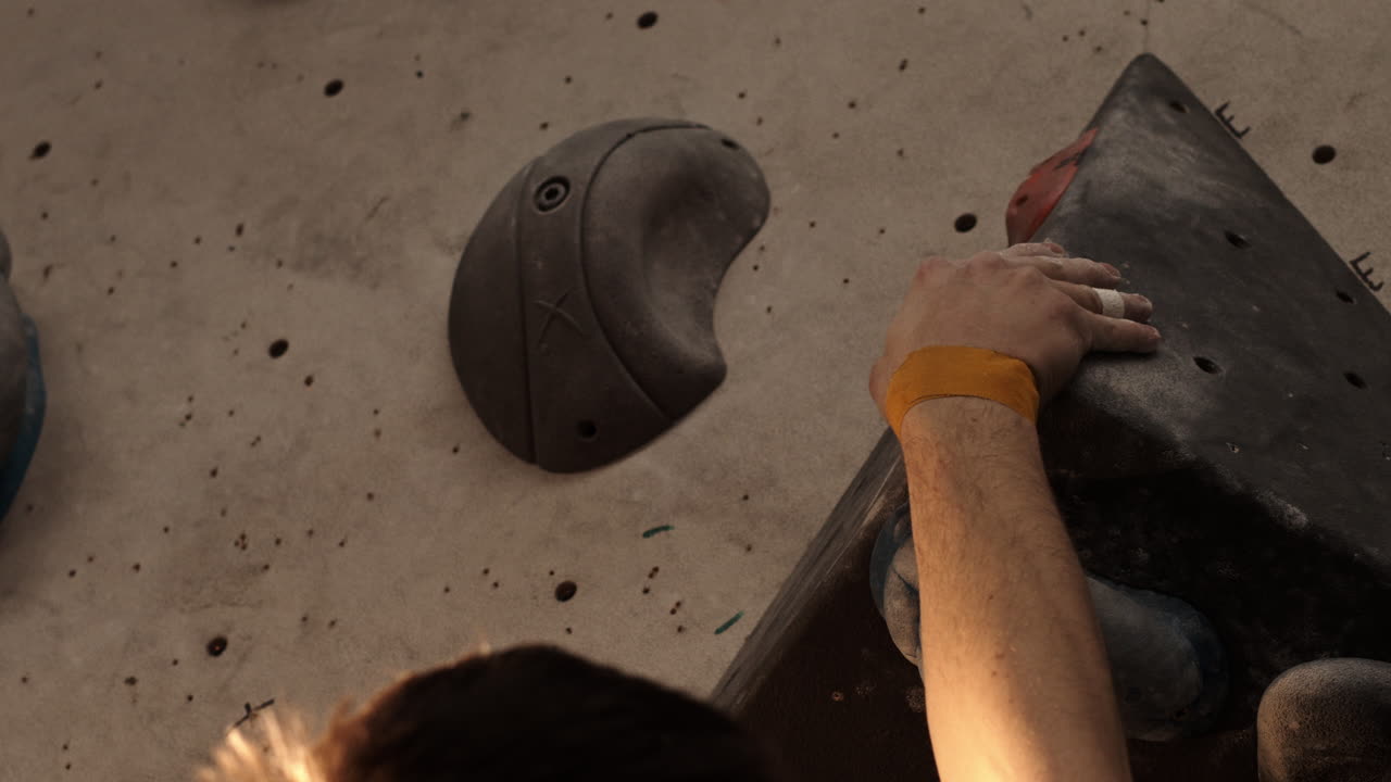 Man rock climbing in gym