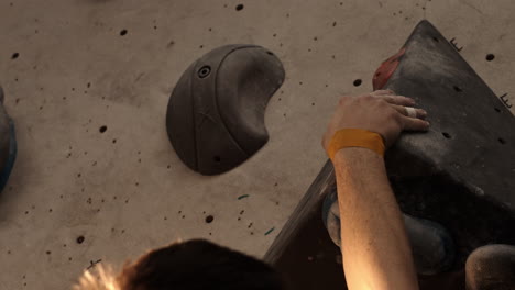 man rock climbing in gym