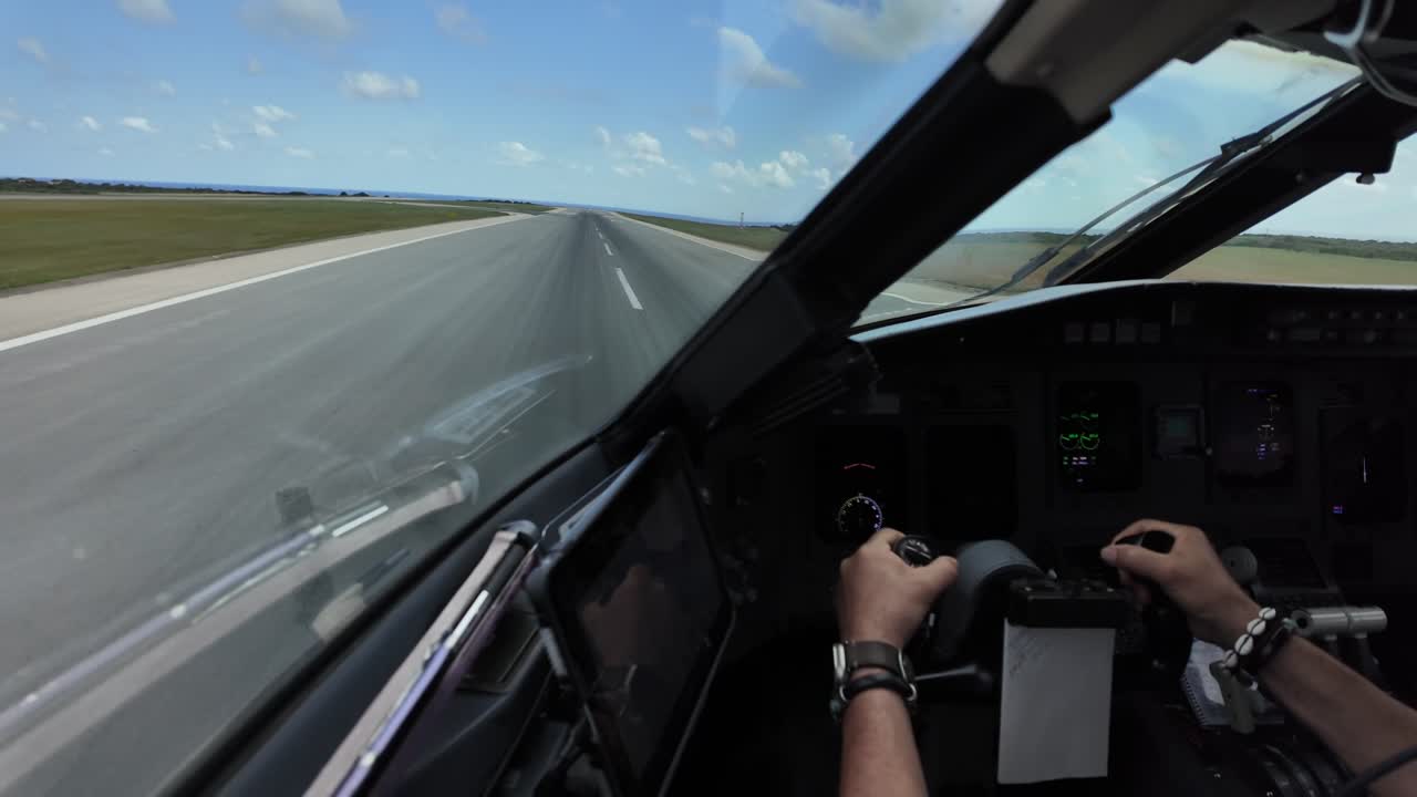 An immersive pilot FPV from the cockpit of jet airplane, with a close-up view of the hands of the Captain pulling the flight controls during the rotation.