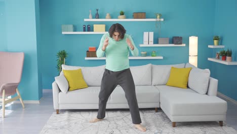 Funny-man-doing-karate-in-a-funny-way-at-home.