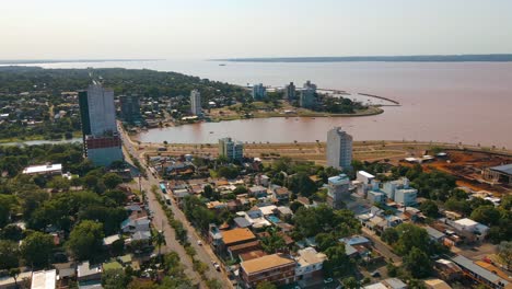 aerial view capturing bahia del brete in posadas city, featuring the beautiful paraná river in the backdrop