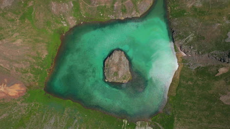 epic looking down cinematic aerial drone high elevation dreamy heavenly island lake silverton ice lake basin unreal caribbean aqua blue silverton colorado lush green summer rocky mountains up circle