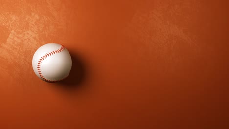 pelota de béisbol girando sobre un fondo naranja marrón con copyspace