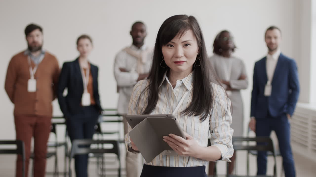 Asian Businesswoman Posing with Tablet Computer