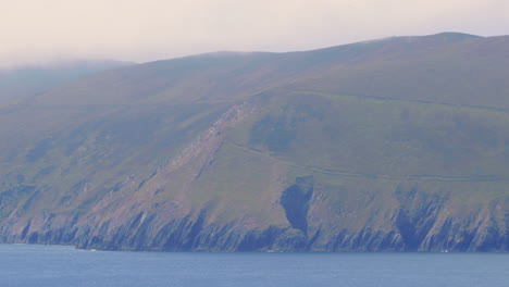 ireland rugged cliffs and countryside, telephoto shot - zoom out