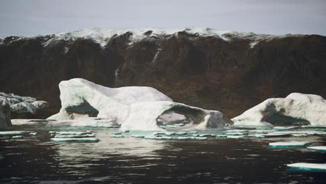 blue icebergs of antarctica with frozen and snow covered antarctic scenery