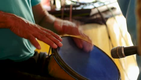 man playing the drum in a typical party