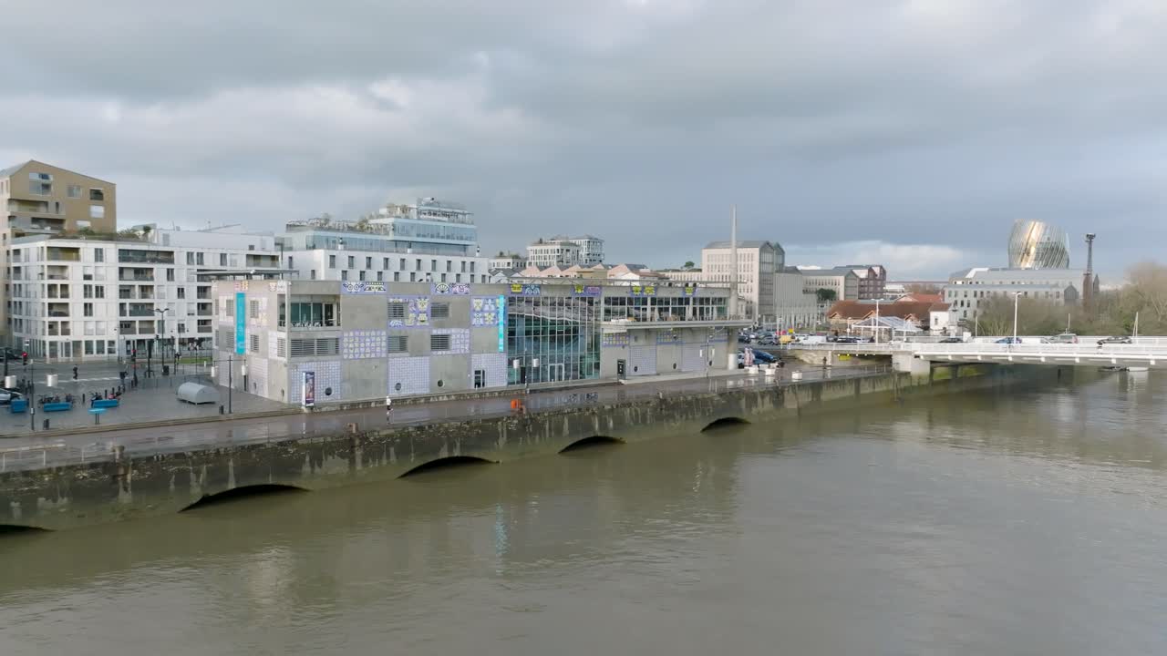 The CAP Sciences children's museum building in the Garonne River shore in Bordeaux France, Aerial close in orbit shot