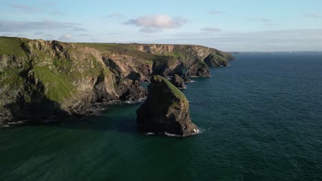 treyarnon bay with rocky cliffs along the cornish coastline in the south west of england, uk