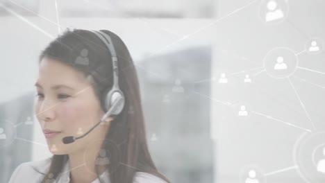 Animation-of-networks-of-connections-with-icons-over-businesswoman-using-phone-headsets