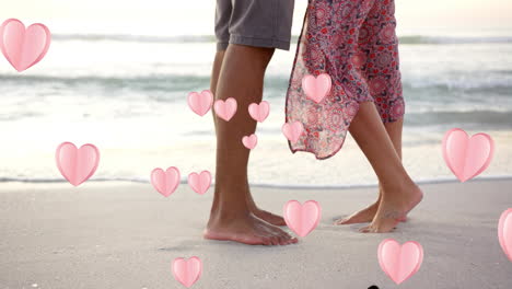 animation of hearts moving over legs of diverse couple in love on beach in summer