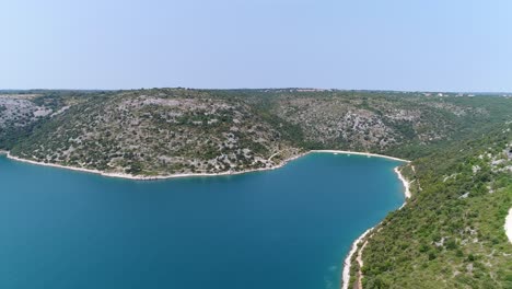 pula sea in croatia, rakalj aerial panoramic drone view of bay in european beach coastline, summertime vibes, clear daylight