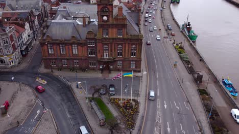 Aerial-shot-of-great-yarmouth-city-street-and-Ukraine-and-England-flag-waving-in-the-air