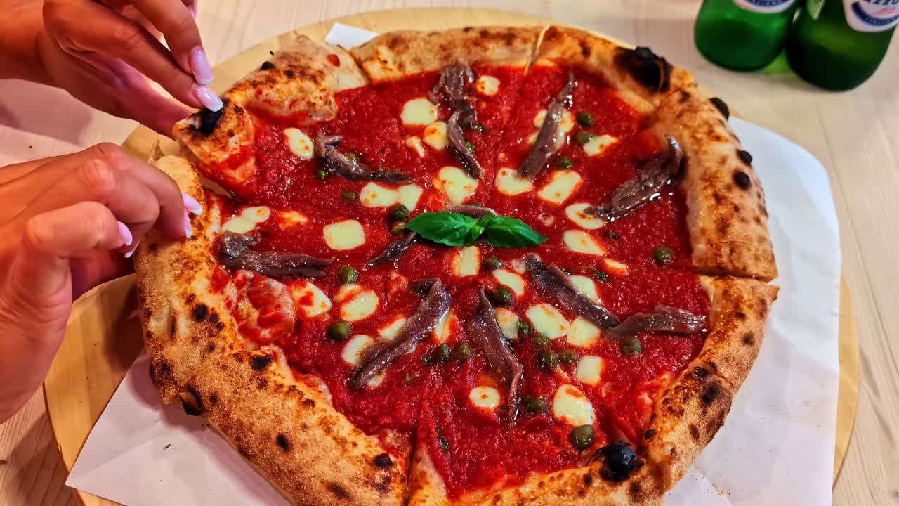 Eating Neapolitan pizza traditional italian food from Napoli Italy in authentic restaurant