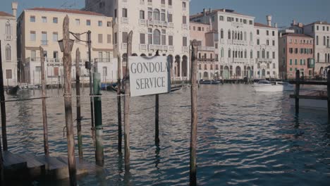 gondola service sign on grand canal, venice italy