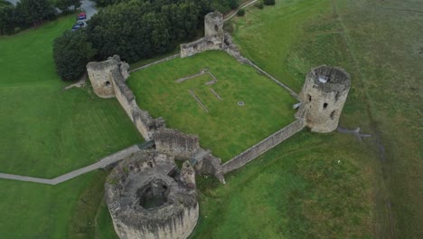 flint castle welsh medieval coastal military fortress ruin aerial view rising top down shot