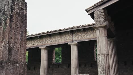 corinthian columns in pompeii's gladiators' barracks, italy