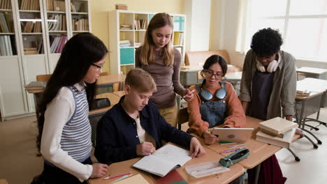 group of students studying and collaborating in a classroom