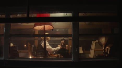 couple in a vintage train car at night