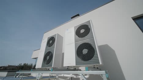 outdoor heat pump units installed on modern building