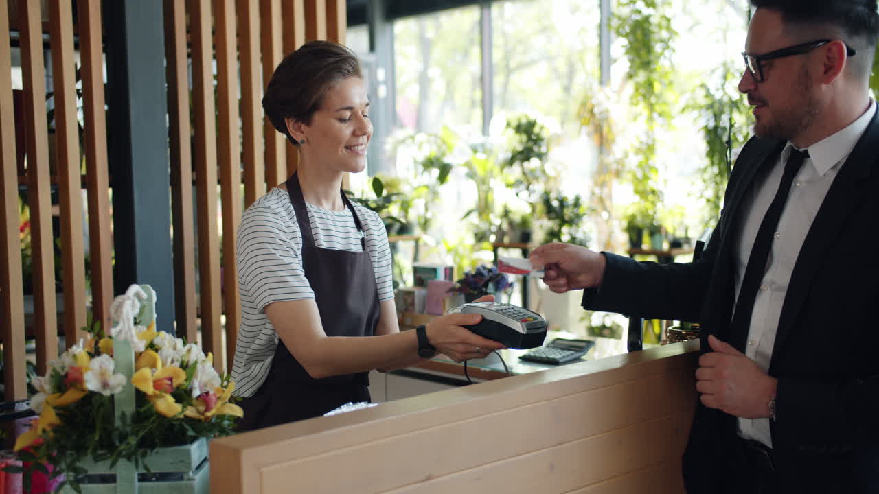 Customer Purchasing Flowers at a Florist Shop
