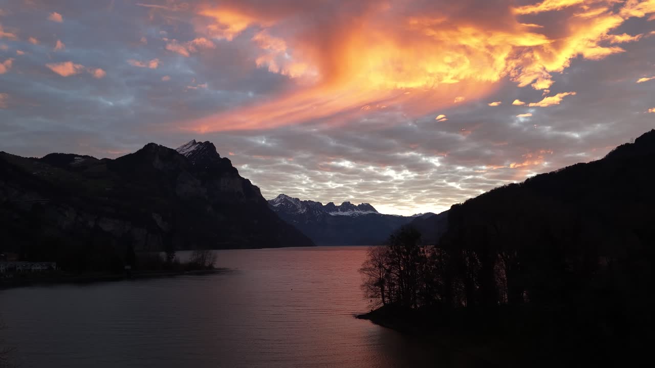 Lake and mountain landscape at sunset in the Switzerland Alps