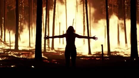 a striking contrast: a silhouette embraces destruction amidst a raging inferno in a forest, capturing the essence of nature's ferocity and human resilience