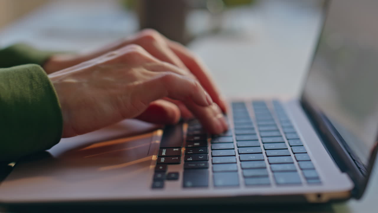 Lady hands typing keyboard laptop at apartment closeup. Woman writing notes