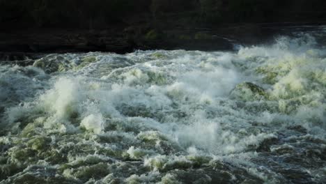 wide shot of rushing nile river in uganda