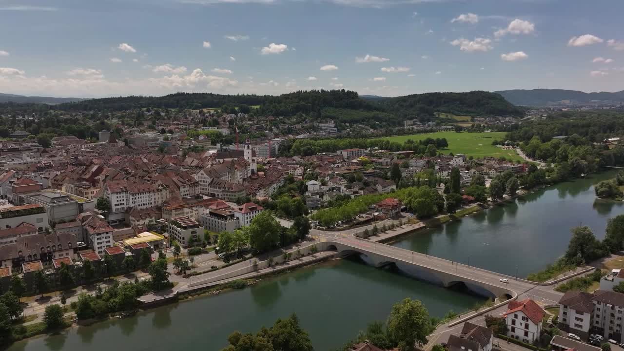bridge over river in aarau with city buildings and swiss landscape in kanton aargau