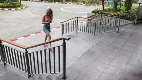 woman walking down stairs