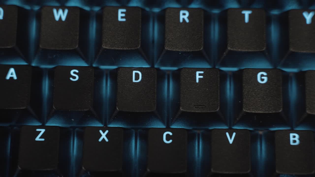 Pushing left across the keyboard in extreme close up