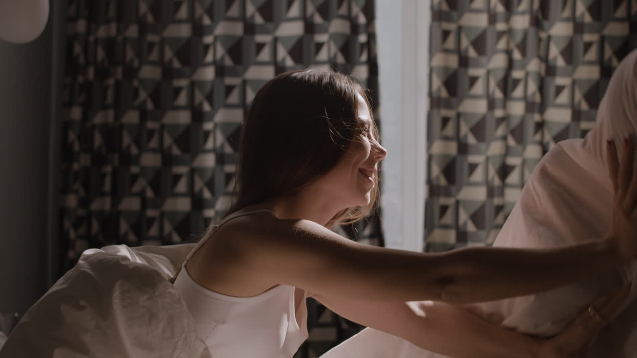 Woman Playing with a Blanket in Bed