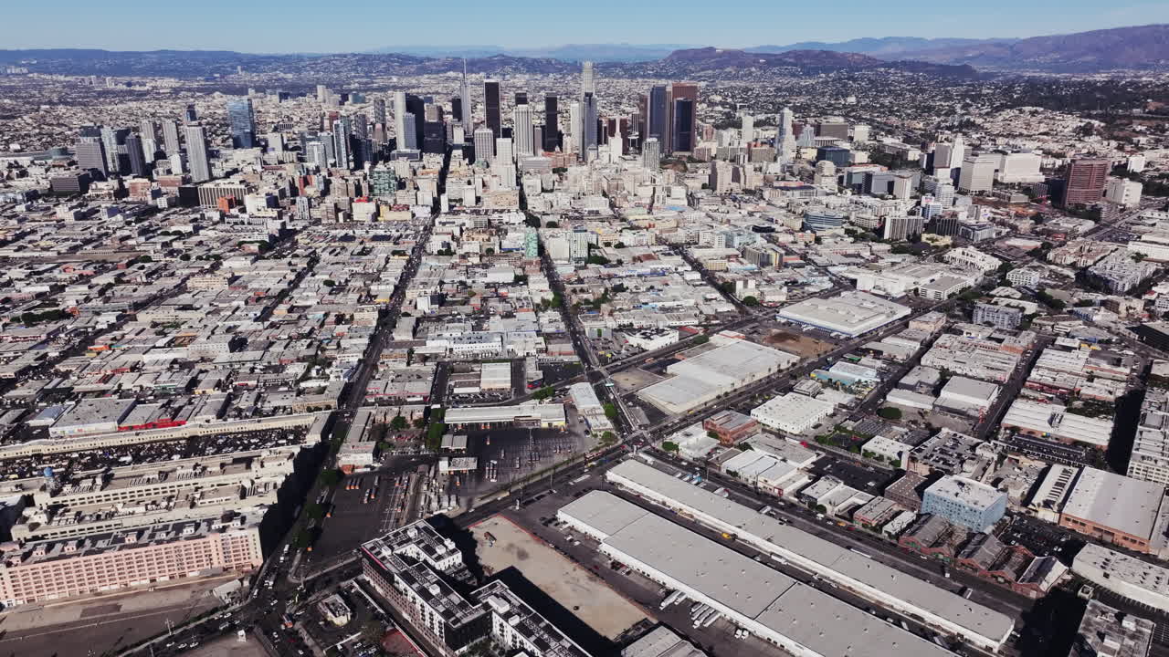Panoramic aerial view of downtown Los Angeles cityscape with surrounding urban sprawl