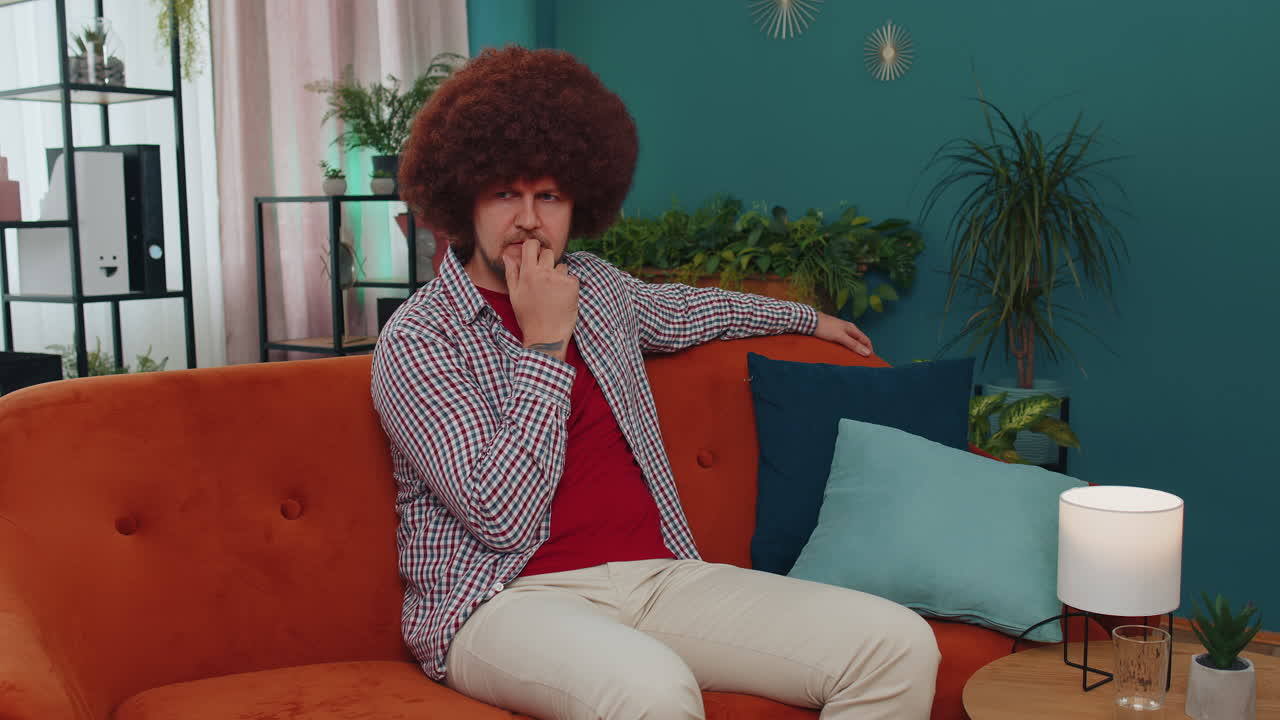 Young man at home suffers from unfair situation problem, break up, depressed, feeling bad, burnout