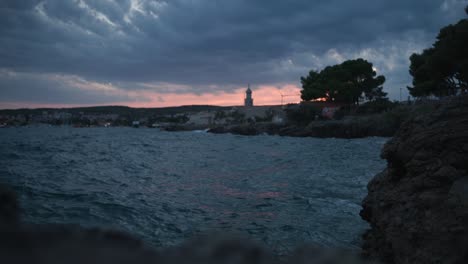 Waves-on-the-sea-with-the-background-of-the-old-town