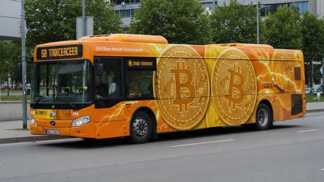 vibrant cryptocurrency bus featuring bitcoin logo and design, showcasing modern transportation with eye-catching branding in urban environment