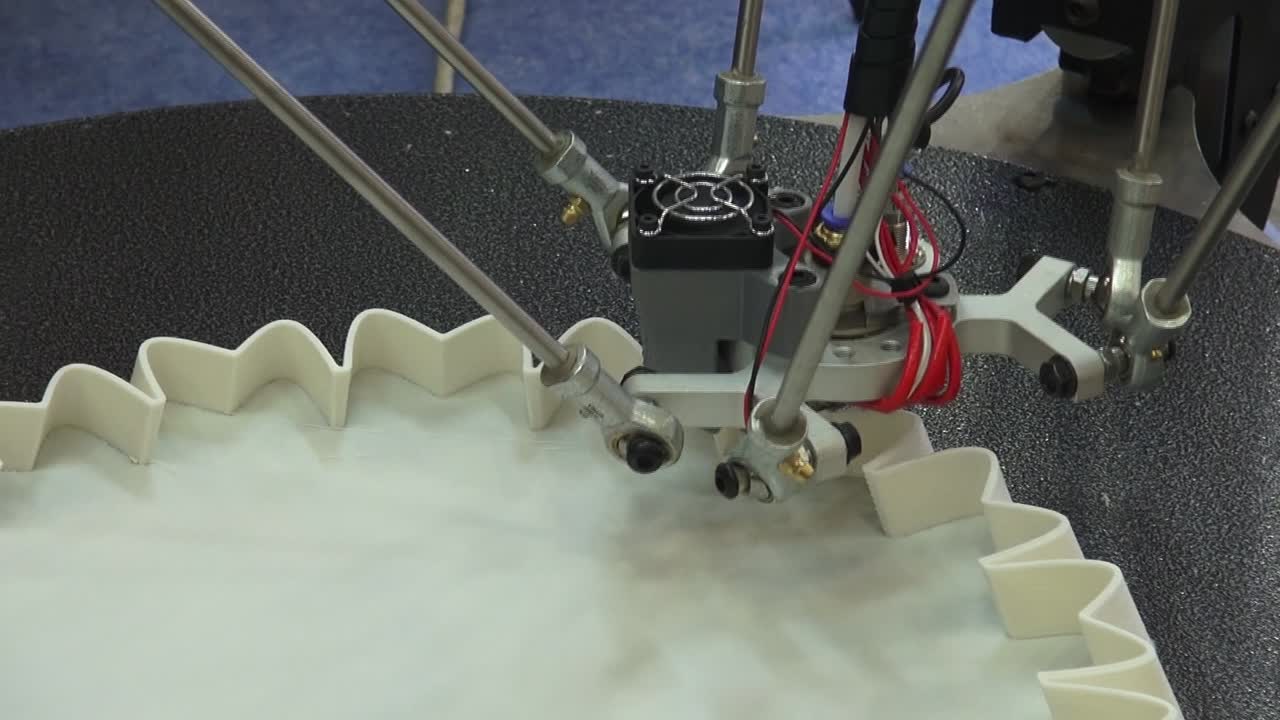 Close up of a 3D Printer prinring a vase