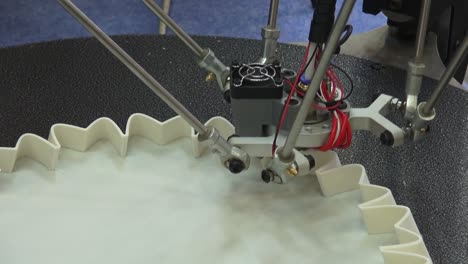 close up of a 3d printer prinring a vase