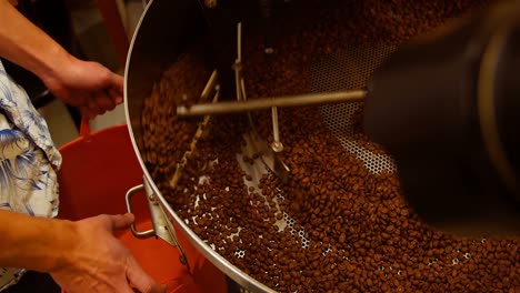 man using coffee grinding machine