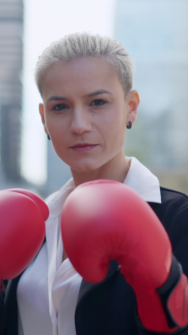 Empowered Woman with Red Boxing Gloves