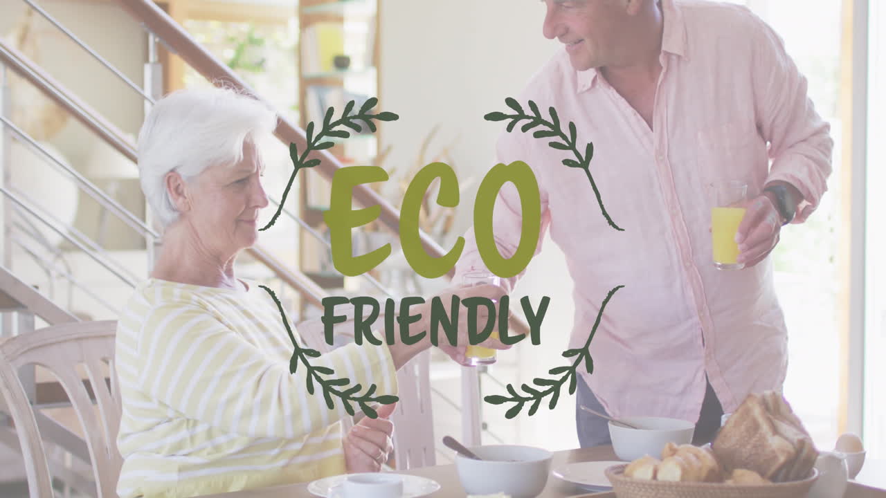 Animation of eco friendly text over caucasian senior couple eating at home